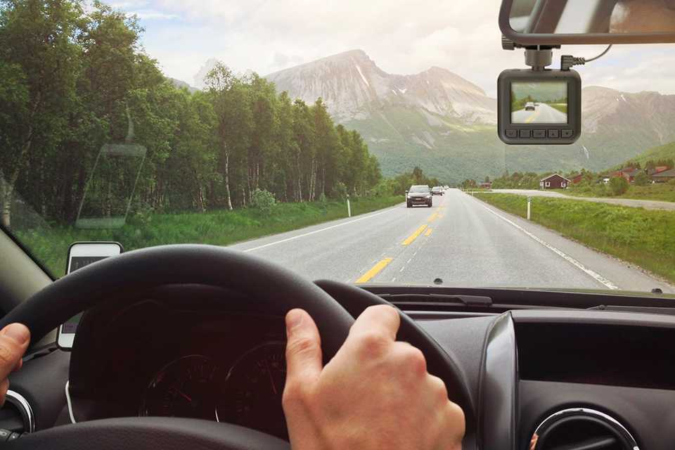 A Binatone full HD quick release dash cam installed in a car.