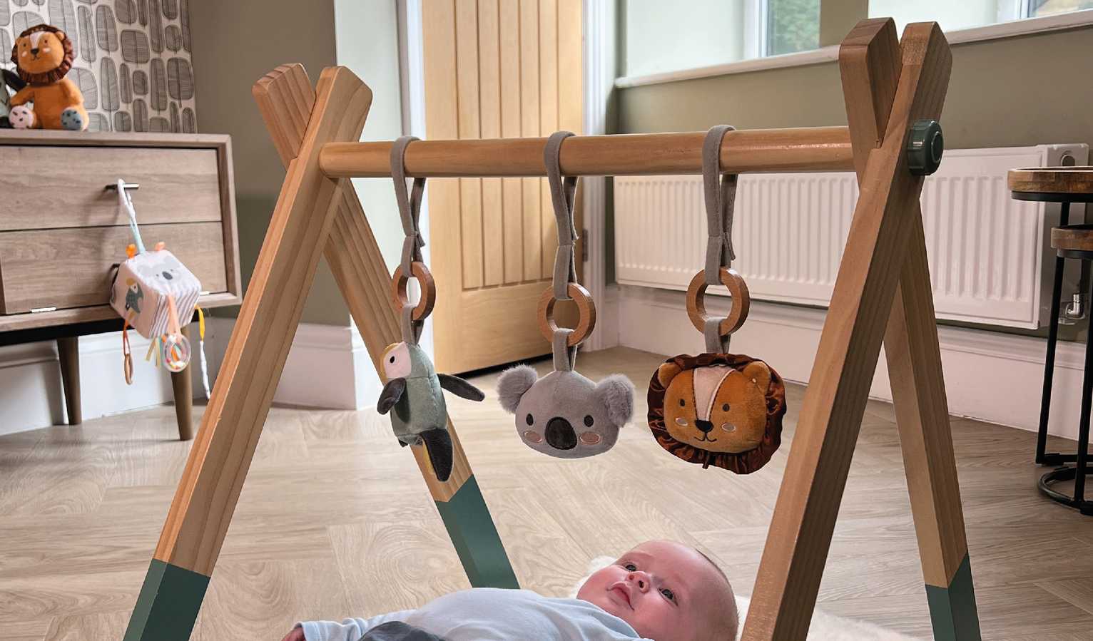 A baby on a playmat.