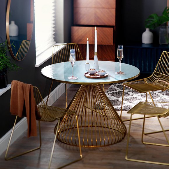 Habitat Huxley metal dining table and 4 brass chairs.