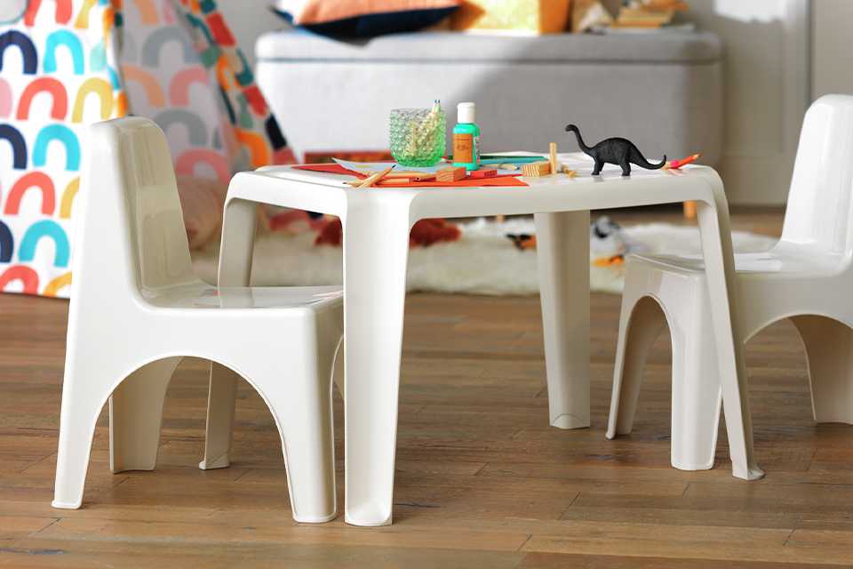 Kids arts and crafts table in white with white chair.