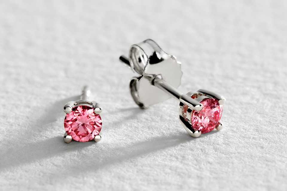 A Pure Brilliance set of white gold pink diamond earrings.