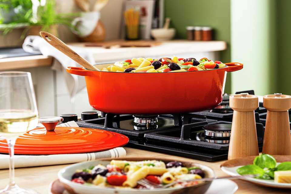 Habitat 4.7 Litre Cast Iron Oval Casserole Dish in orange colour.