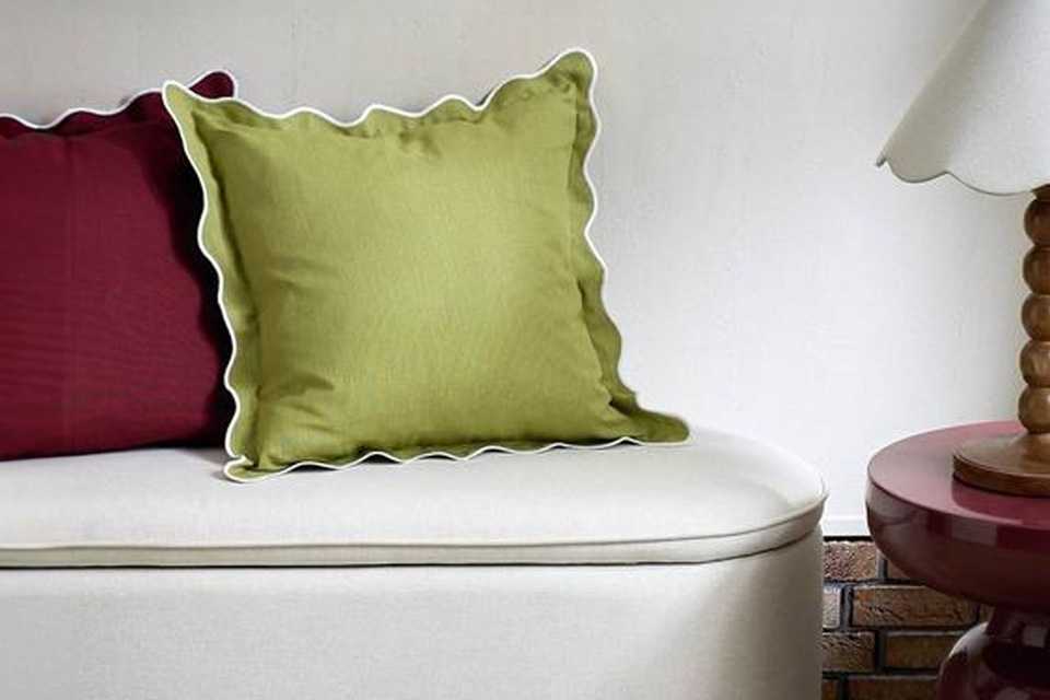 A Habitat scallop cushion in olive.