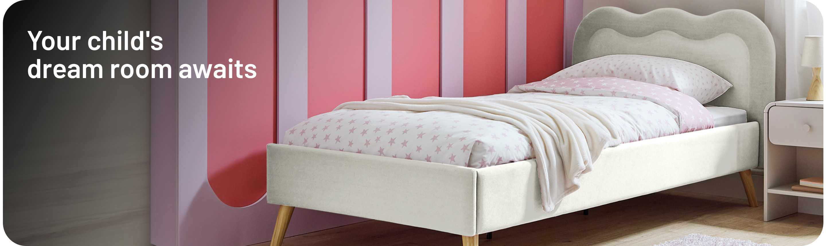 A banner with a Habitat kids' white upholstered bed in a child's room.