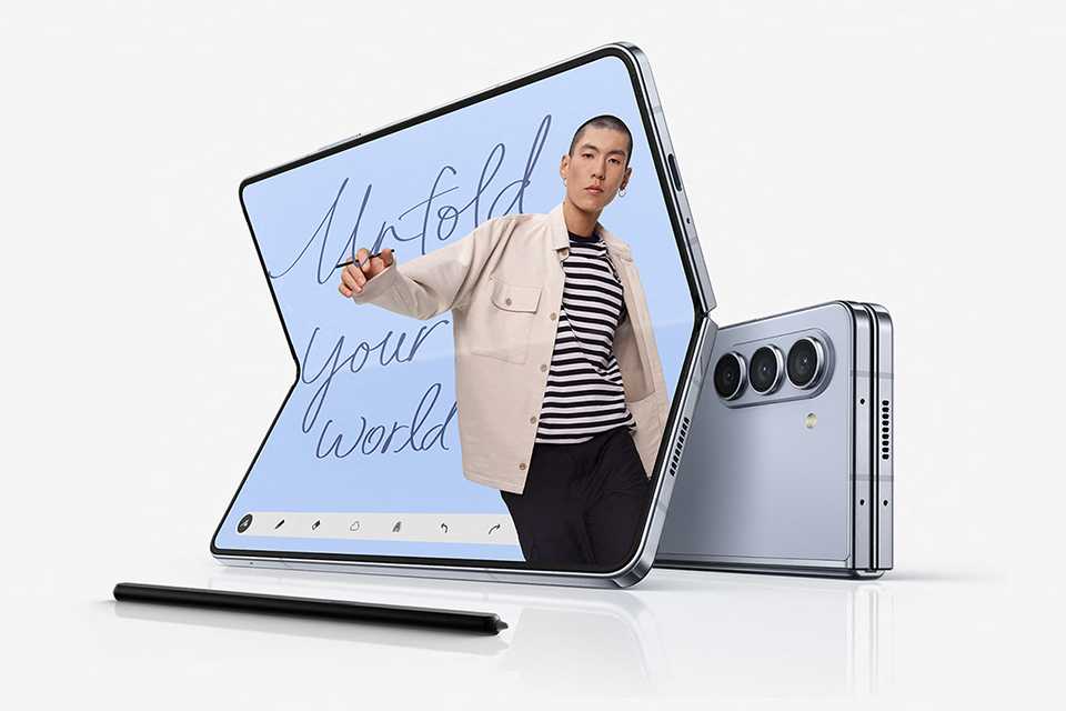 Two Samsung Galaxy Z Fold5 smartphones with an S pen.