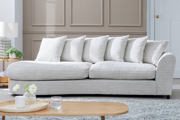 Harry Curve sofa in light grey fabric.