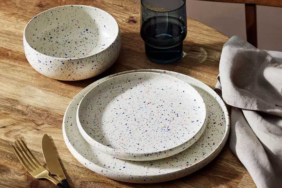 A Habitat Reactive Speckle 12 piece dinner set in white.