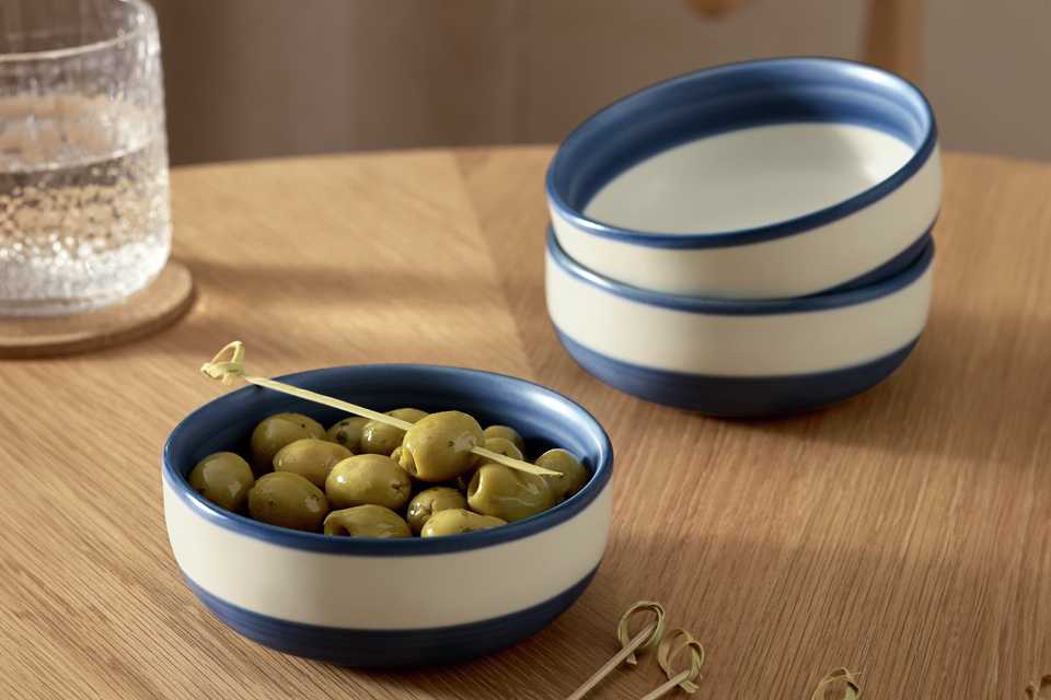 A Habitat Artisan stripe set of 3 stoneware nibble bowls in blue.