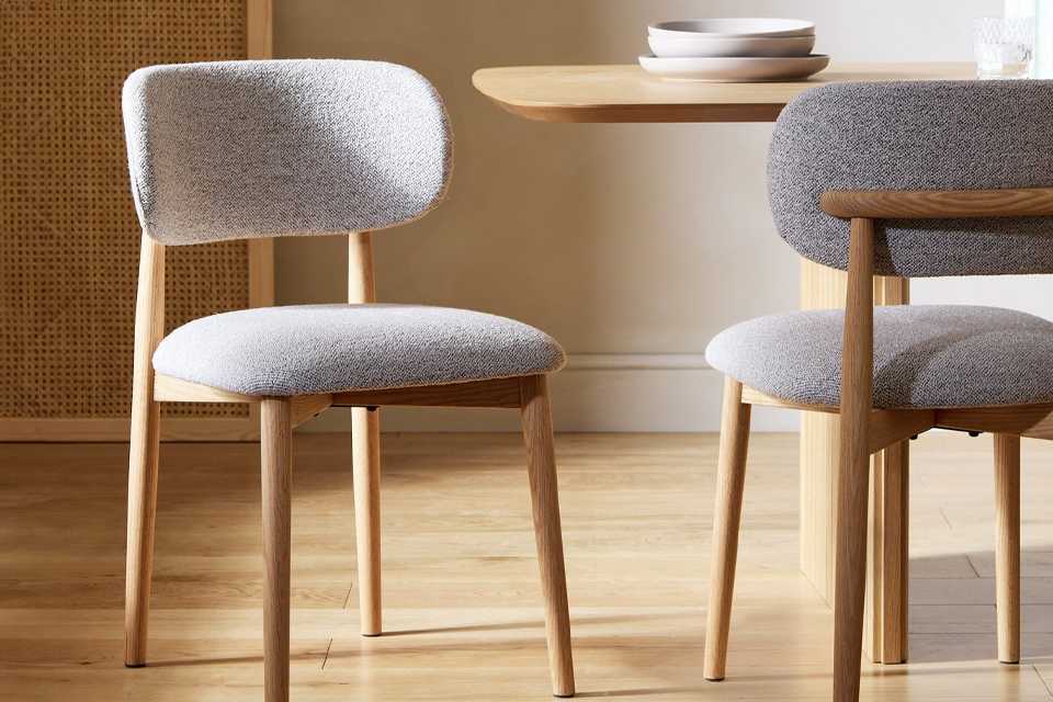 A pair of Habitat Arona natural oak chairs.