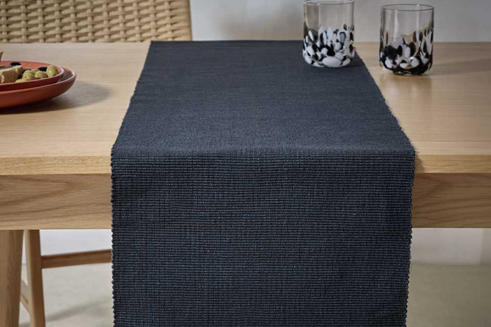 A Habitat black ribbed cotton table runner.