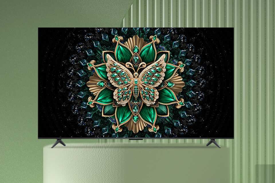 A bright and colourful screensaver displayed on a TCL Mini LED TV against a green background.