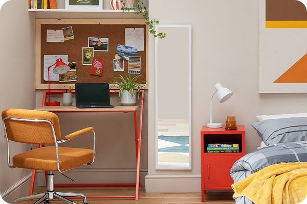 uni bedroom featuring a red desk and orange change and a double bed