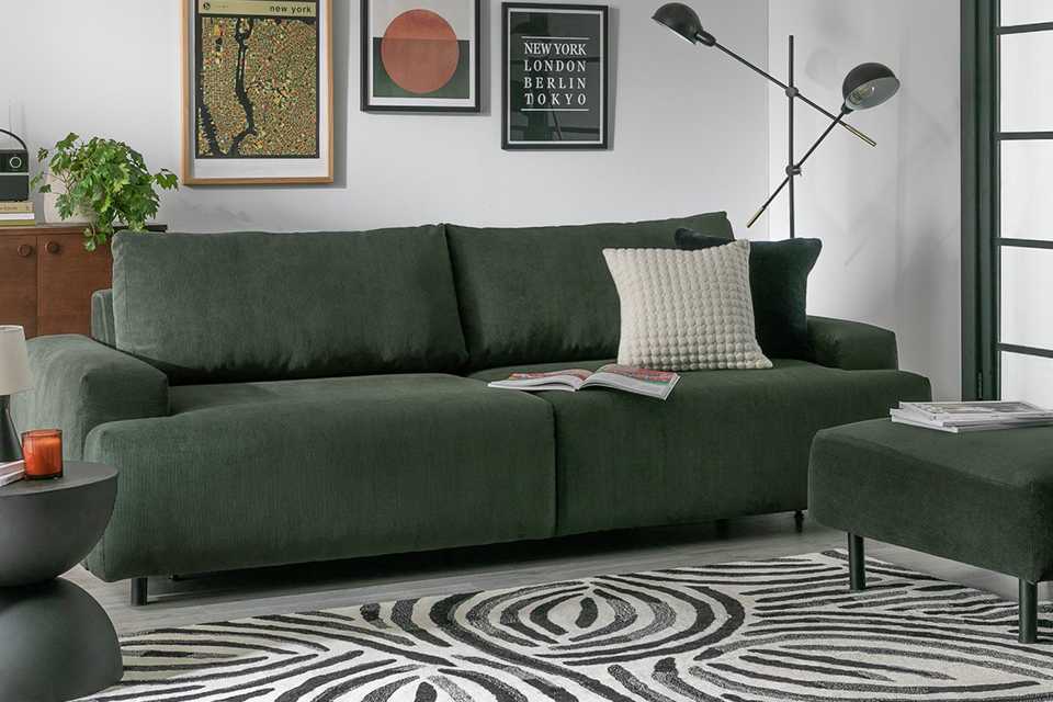 Green ready made sofa from Habitat in living room.