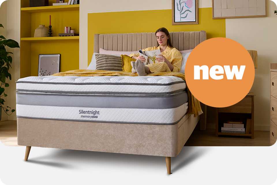 A woman sitting on a Silentnight memory foam mattress.