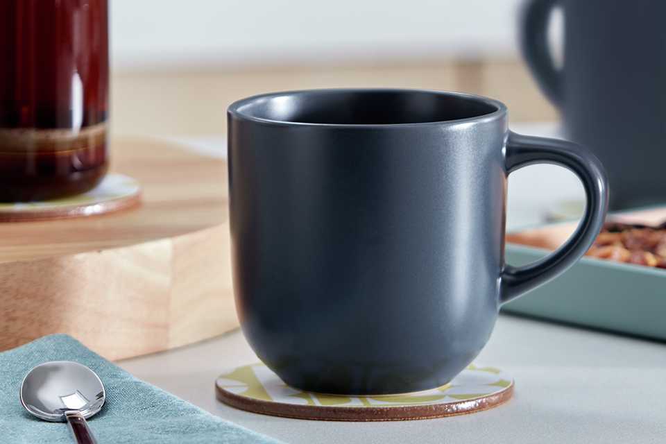 A Habitat matte glaze set of 4 stoneware mugs in charcoal colour.
