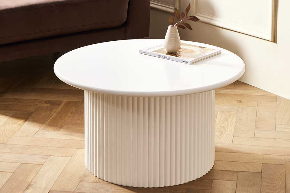 A Habitat Luan slatted round coffee table in white.