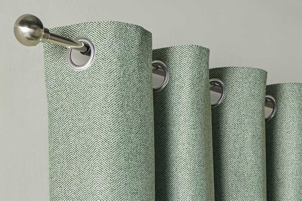 Habitat Textured Blackout Herringbone Eyelet Curtain in green colour.