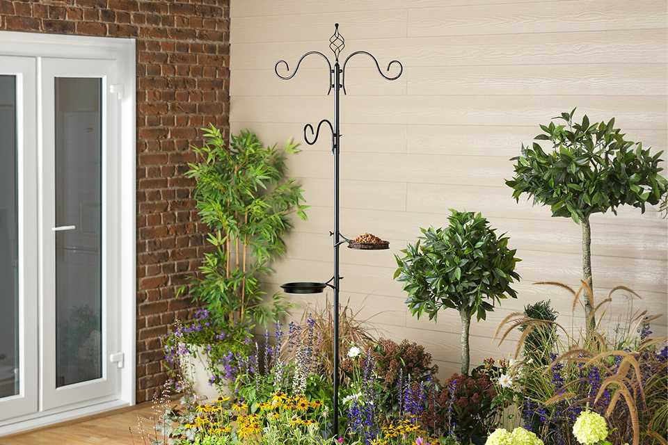 Argos Home Wild Bird Feeding Station placed outdoors in a garden.