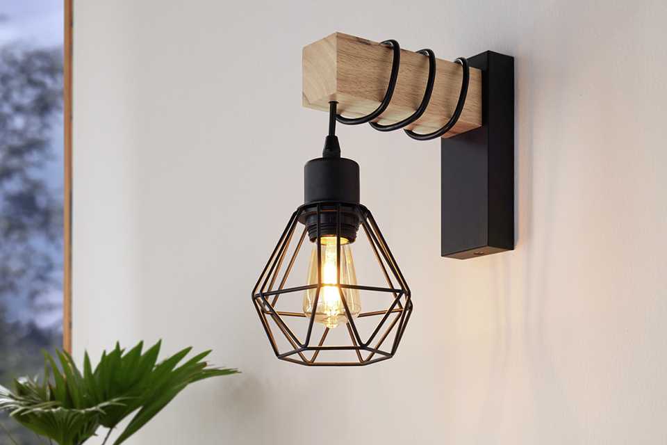 An EGLO Townshend black wooden wall light.