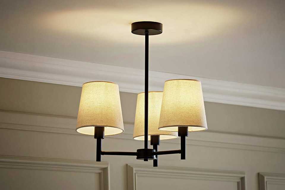 A ValueLights Kincaid black metal 3-light chandelier.