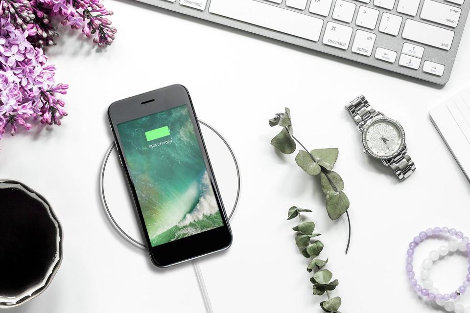 Close-up phone charging on wireless charger device.