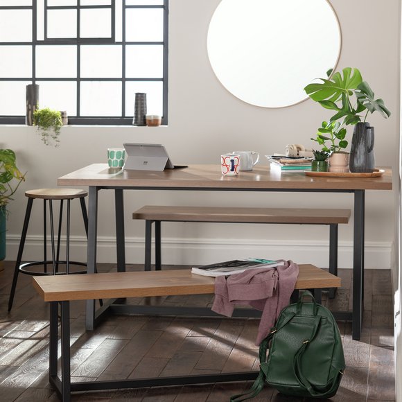 Industrial style dining set on wooden floor.