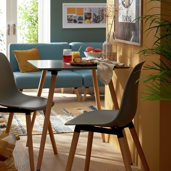 Square dining set in open plan setting.