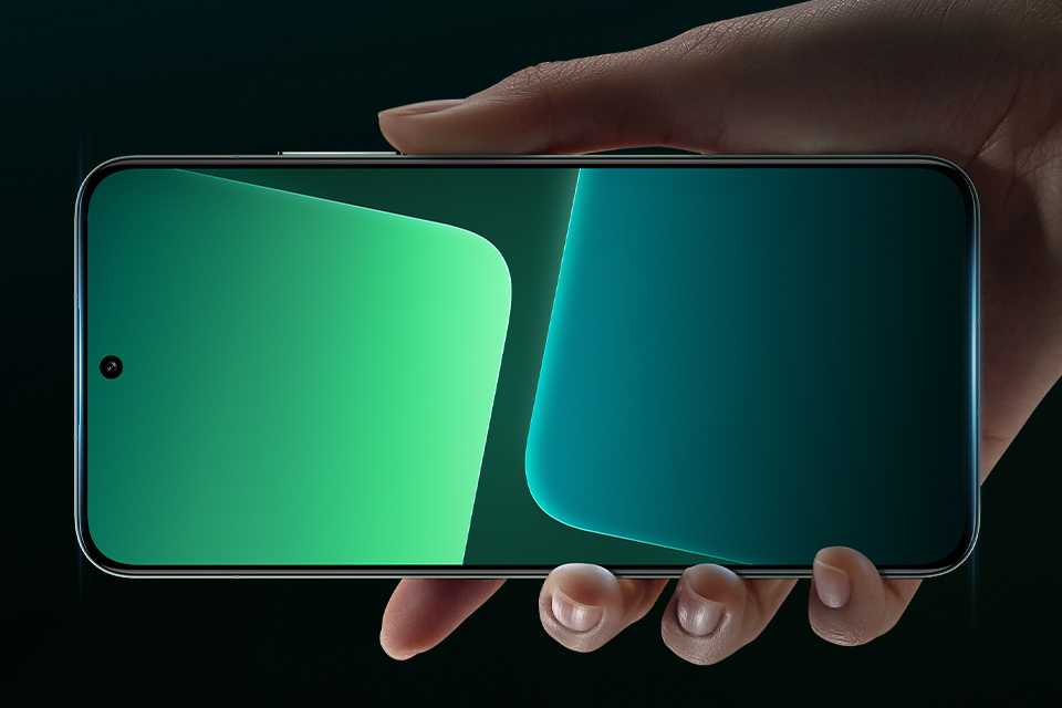 A hand holding a smartphone showing tiny screen bezel.