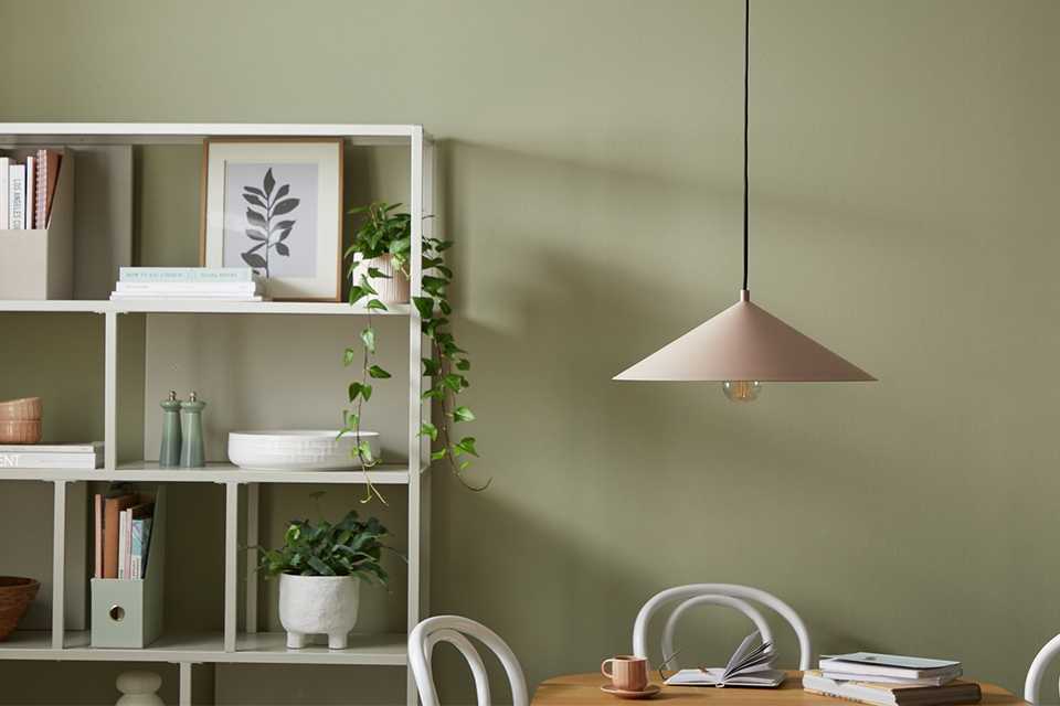 Hanging ceiling light above dining room table.