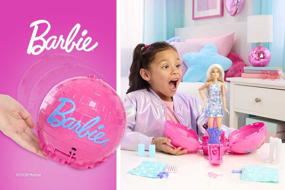 An excited little girl admires her brand new Barbie popping out of a pink ball.