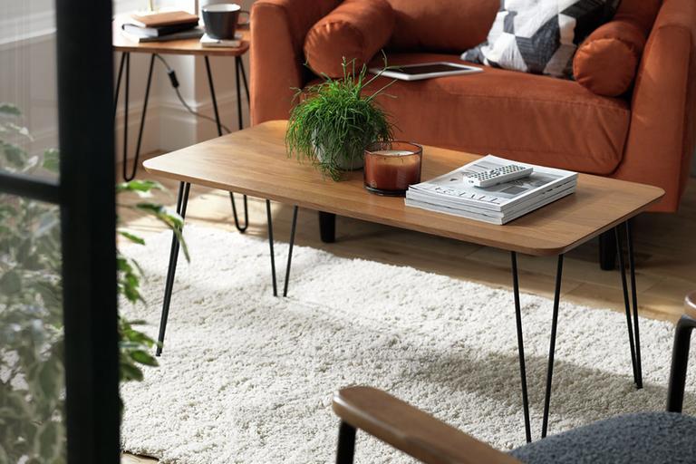 Image of rectangular brown coffee table with black hairpin legs.