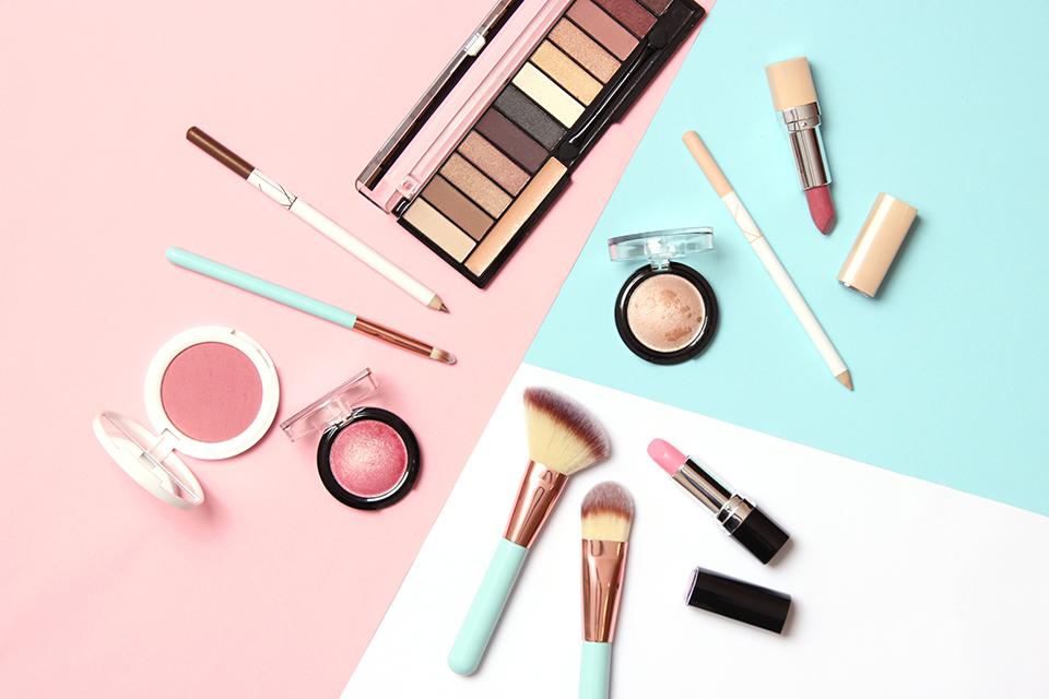 Neutral coloured makeup and makeup brushes.
