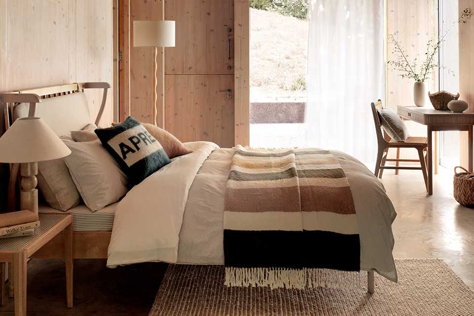 A bedroom designed using Habitat furniture in the Alpine retreat trend style.