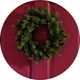An Argos Home plain foliage Christmas wreath on a door.