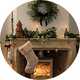A close up image of a wreath over a mantel decorated for Christmas.