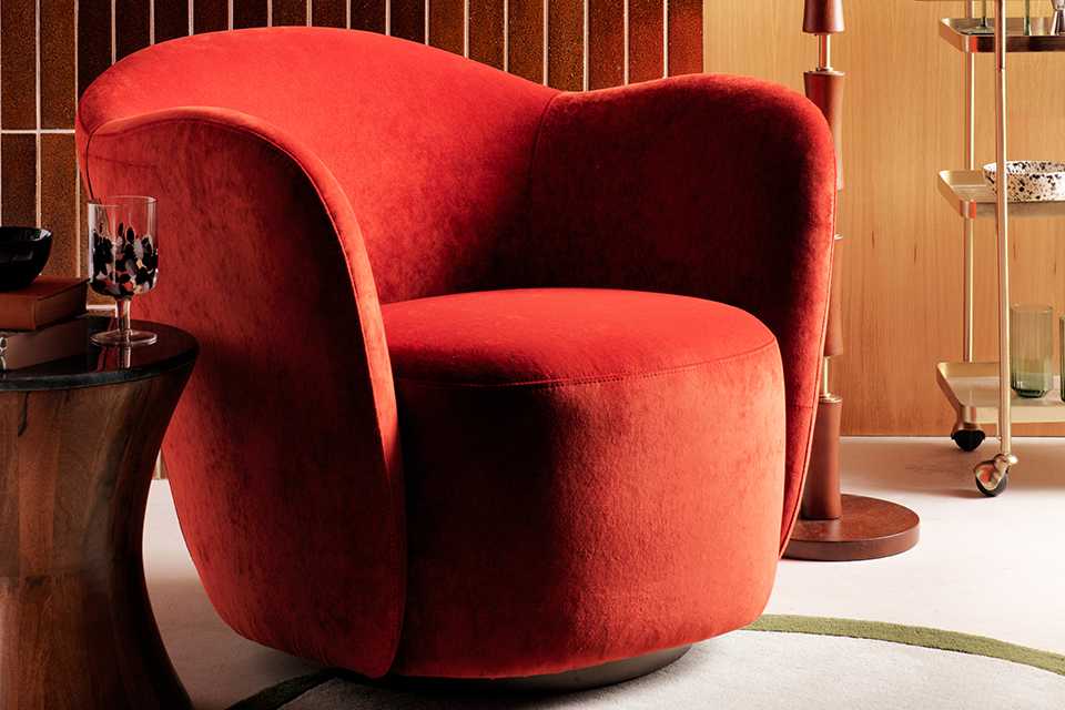 Orange velvet accent chair.