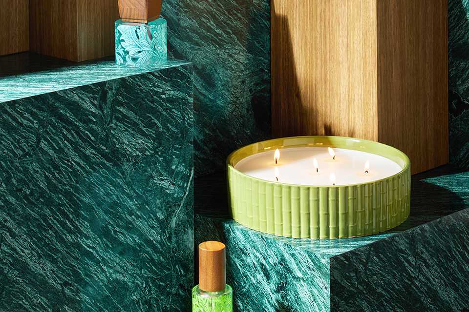 Morris & co candles and diffusers in blue bottles and green and blue ribbed candle jars.