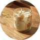 Autumn spice candle in a glass jar with pressed natural botanicals.