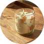 Autumn spice candle in a glass jar with pressed natural botanicals.