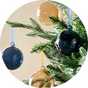 A Christmas tree decorated with a Habitat pack of 4 glass baubles.