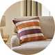 Argos Home Autumn Check Blanket Stitch Cushion on a sofa.