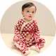 Baby Christmas pyjamas with festive check pattern and cosy seasonal design.