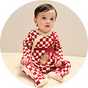 Baby Christmas pyjamas with festive check pattern and cosy seasonal design.
