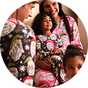 Family wearing matching Christmas pyjamas while celebrating festive moments together.