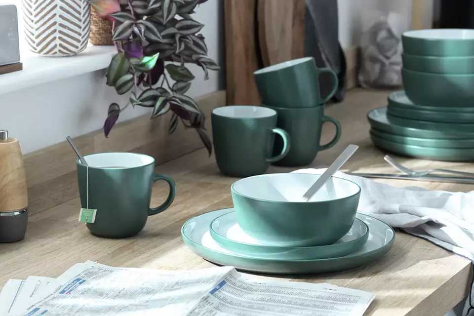 A Habitat two-tone stoneware dinner set in a kitchen.