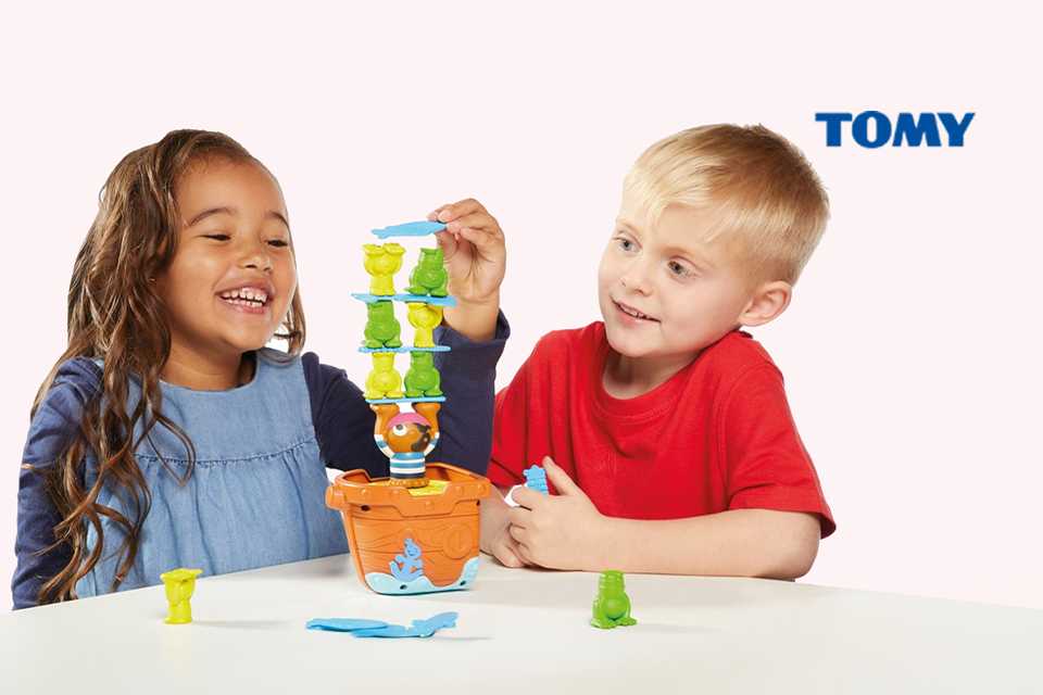 Two friends playing with Tomy pile up pirates game.