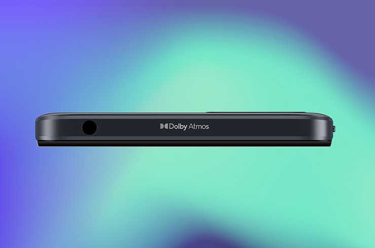 Side angle of a black moto e13 smartphone showing Dolby Atmos® branding.