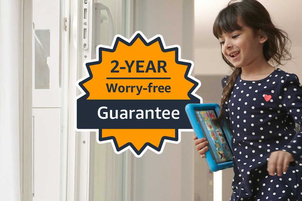 Little girl holding a blue Fire kids' tablet with a 2-year guarantee logo super imposed on image.