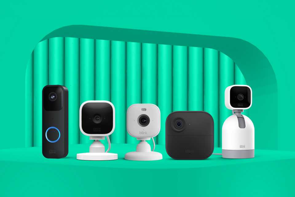 Five Blink smart home security devices displayed against a green background.