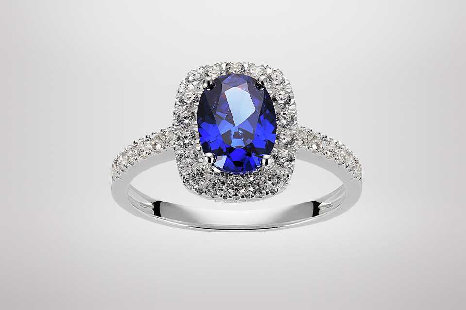 A Revere Sterling Silver Cubic Zirconia Solitaire Halo Ring in size.